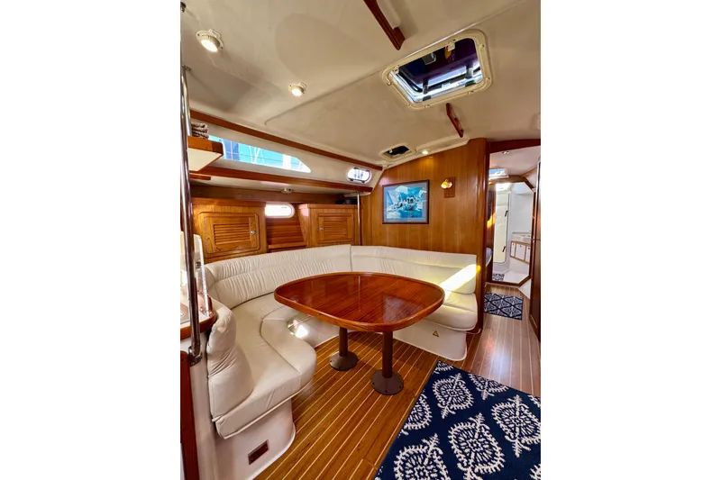 Slide: The Image of Luxurious interior of a 2005 Catalina 42 MkII sailboat with elegant wood finishes. - 39