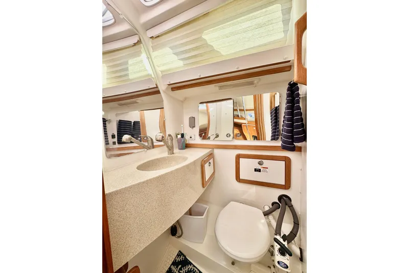 Slide: The Image of 2005 Catalina 42 MkII yacht bathroom with sink, mirror, and toilet. - 40