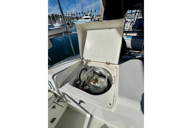 Slide: The Image of Open storage compartment on 2005 Catalina 42 MkII sailboat, revealing propane tank. - 44