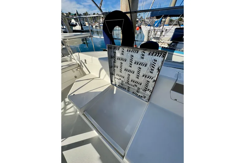 Slide: The Image of Cockpit of 2005 Catalina 42 MkII sailboat with open storage compartment. - 47