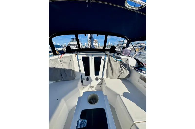 Slide: The Image of Cockpit of 2005 Catalina 42 MkII sailboat with blue canopy and marina view. - 50