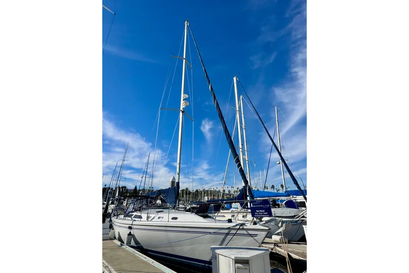 Slide: The Image of Catalina 42 MkII sailboat from 2005 docked under a clear blue sky. - 57