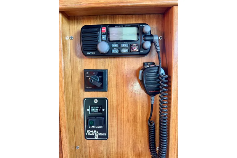 Slide: The Image of VHF radio and control panel on 2005 Catalina 42 MkII sailboat. - 61