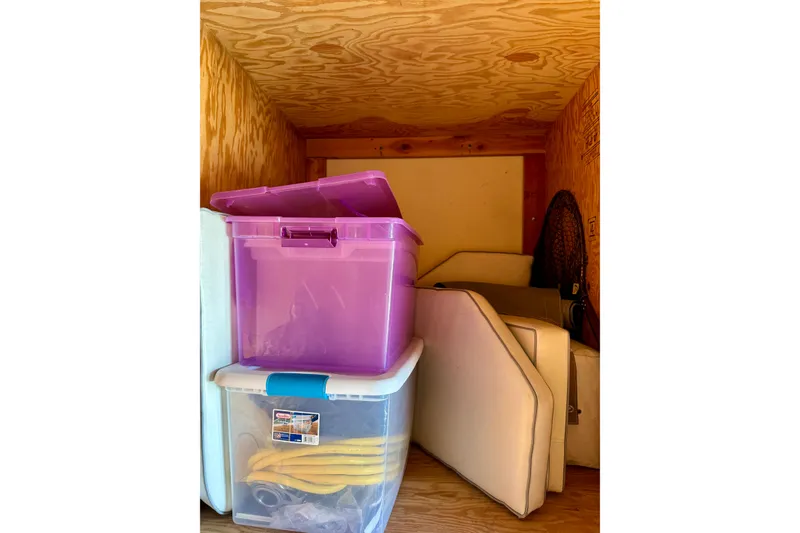 Slide: The Image of Storage area with plastic bins and cushions, Catalina 42 MkII, 2005 model. - 63