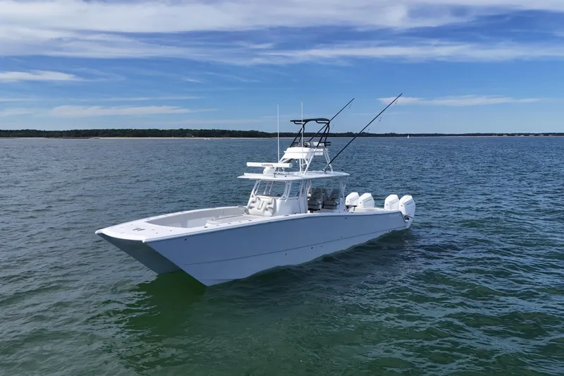 Slide: The Image of Freeman 42LR 2025 boat cruising on open water, side view. - 1