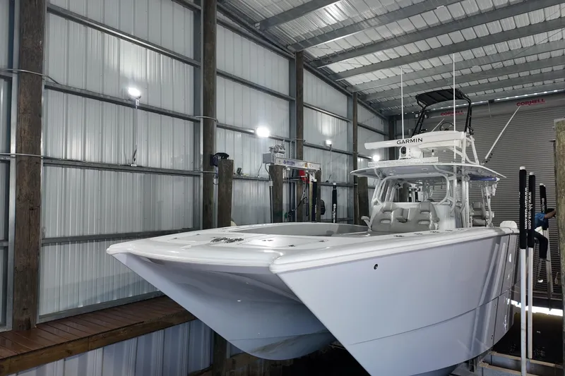 Slide: The Image of Freeman 42LR 2025 boat in a metal storage facility, featuring Garmin equipment. - 25