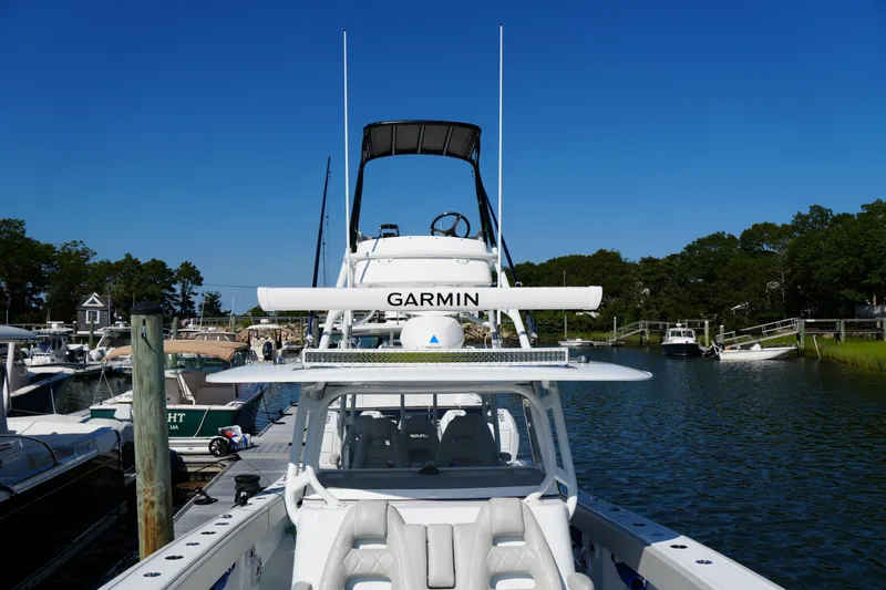 Slide: The Image of Freeman 42 LR 2025 boat docked, featuring Garmin equipment, under clear blue sky. - 34