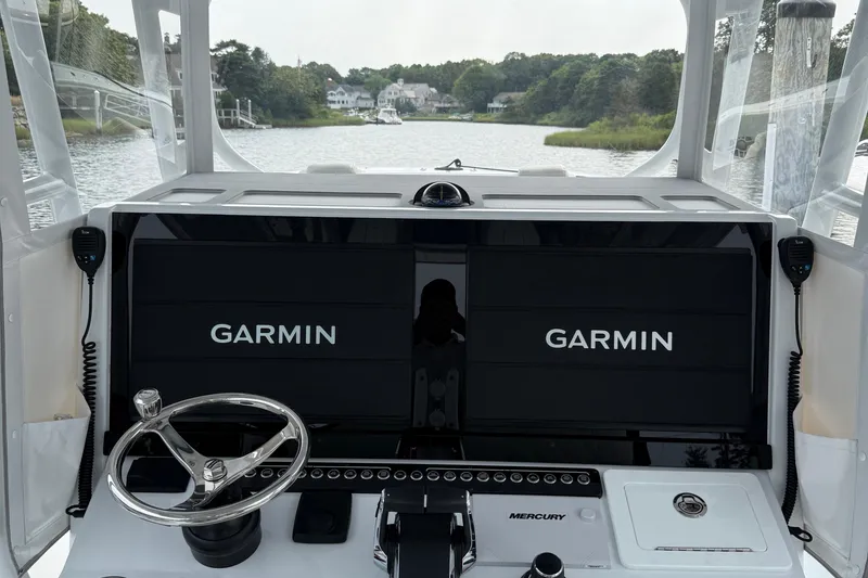 Slide: The Image of Cockpit of 2025 Freeman 42 LR boat with Garmin navigation displays. - 36