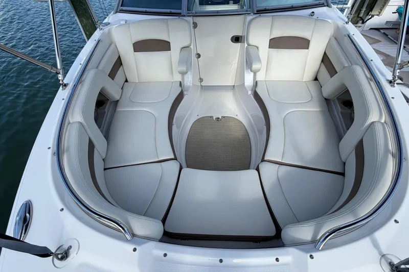 Slide: The Image of 2015 Chaparral 264 Sunesta boat interior with spacious seating and elegant design. - 12
