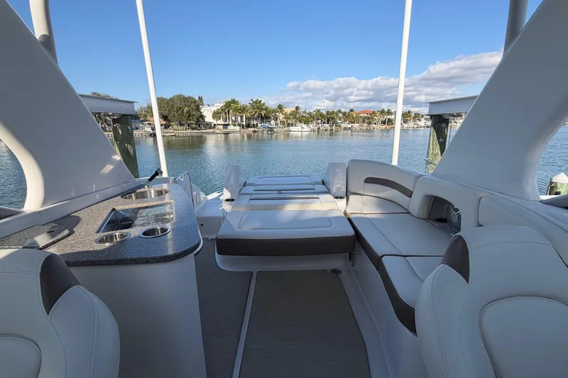 Slide: The Image of 2015 Chaparrall 264 Sunesta boat interior with seating and water view. - 22