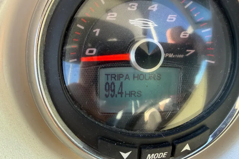 Slide: The Image of Close-up of Chaparrall 264 Sunesta 2015 tachometer showing 99.4 trip hours. - 23