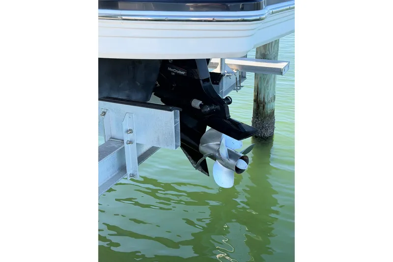 Slide: The Image of 2015 Chaparrall 264 Sunesta boat propeller and outdrive above water. - 7