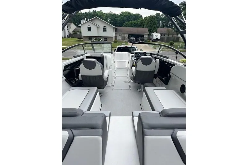 Slide: The Image of 2024 Yamaha Boats AR250 interior with modern seating and sleek design. - 11