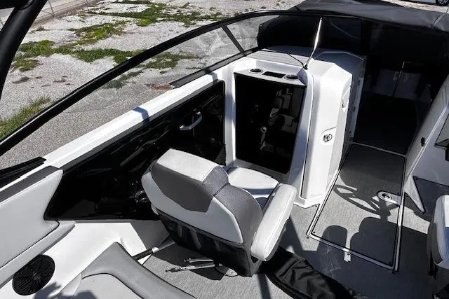 Slide: The Image of 2024 Yamaha Boats AR250 interior with sleek seating and modern dashboard design. - 14