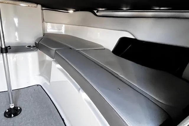 Slide: The Image of 2024 Yamaha Boats AR250 interior cabin with sleek seating and modern design. - 17