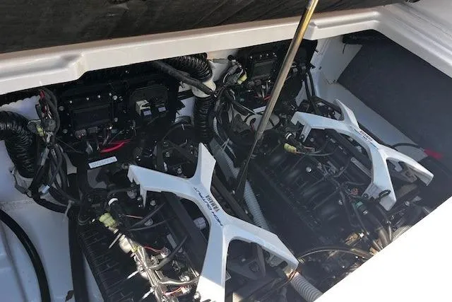 Slide: The Image of 2024 Yamaha Boats AR250 engine compartment showcasing dual engines and intricate wiring. - 22