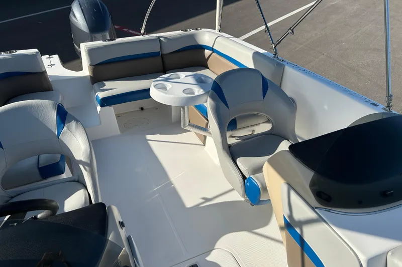 Slide: The Image of 2018 Hurricane Sundeck Sport 218 OB boat interior with seating and table. - 10