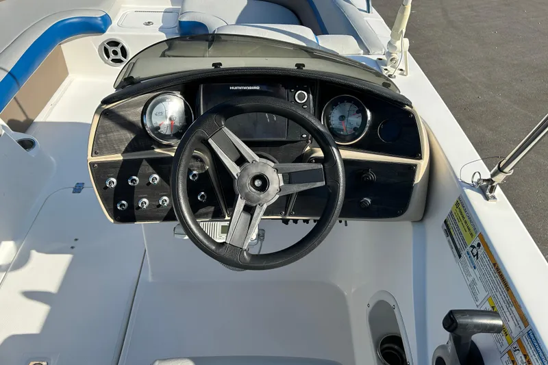 Slide: The Image of 2018 Hurricane Sundeck Sport 218 OB boat dashboard with steering wheel and gauges. - 11