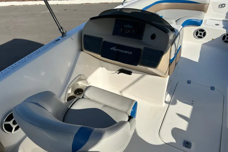 Slide: The Image of 2018 Hurricane Sundeck Sport 218 OB boat interior with helm and seating. - 12