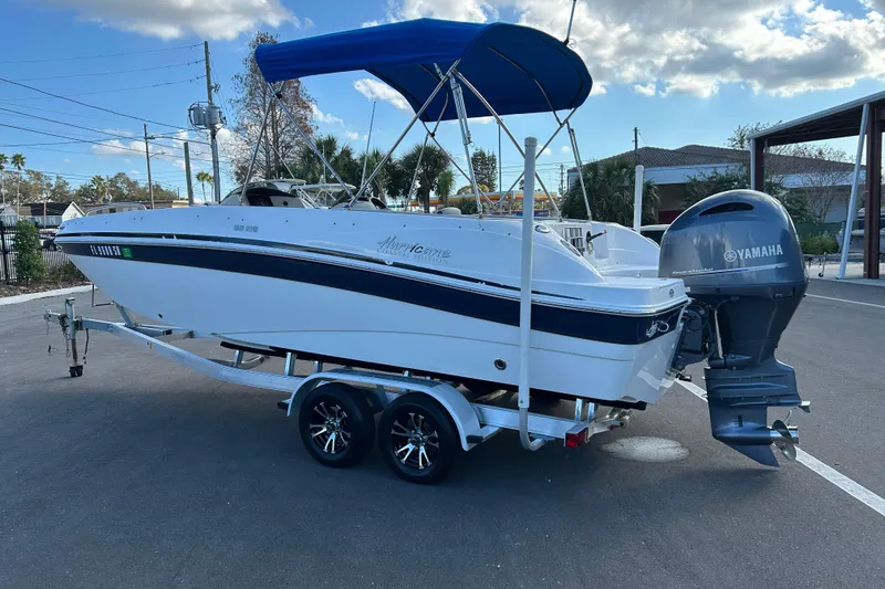 Slide: The Image of 2018 Hurricane Sundeck Sport 218 OB boat on trailer with Yamaha outboard motor. - 4