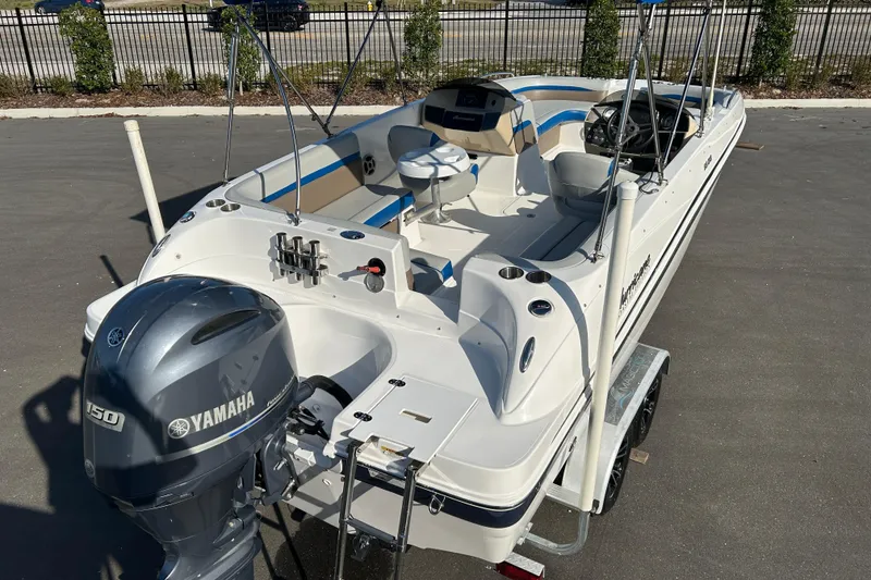 Slide: The Image of 2018 Hurricane Sundeck Sport 218 OB boat with Yamaha 150 engine on trailer. - 7