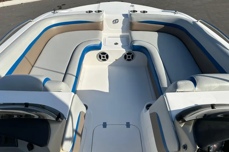 Slide: The Image of 2018 Hurricane Sundeck Sport 218 OB boat interior with cushioned seating and cup holders. - 8