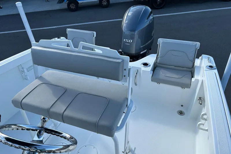 Slide: The Image of 2022 Wellcraft 202 Fisherman boat interior with seating and Yamaha 150 outboard motor. - 12