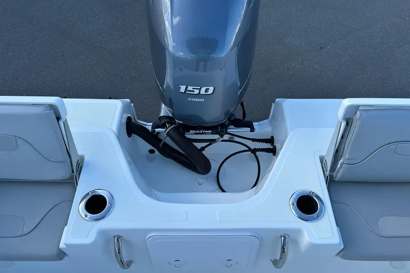 Slide: The Image of 2022 Wellcraft 202 Fisherman boat with Yamaha 150 engine, featuring dual seating and cup holders. - 17