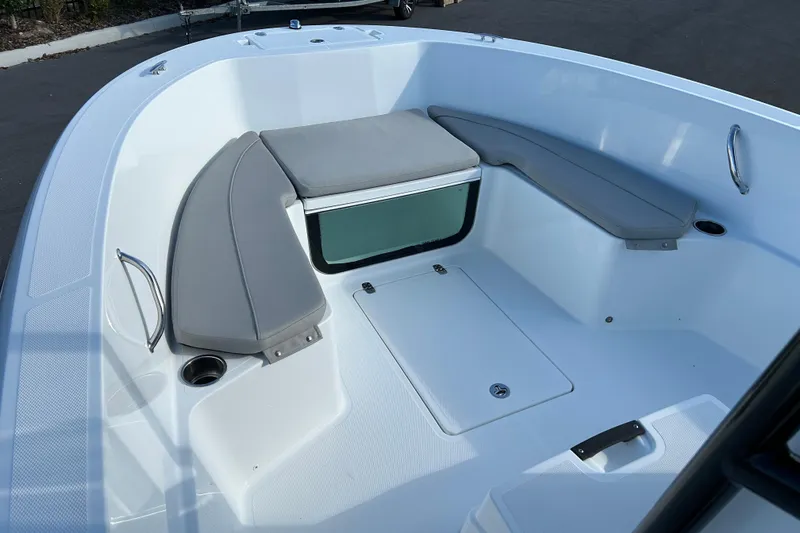 Slide: The Image of 2022 Wellcraft 202 Fisherman boat interior with cushioned seating and storage. - 8