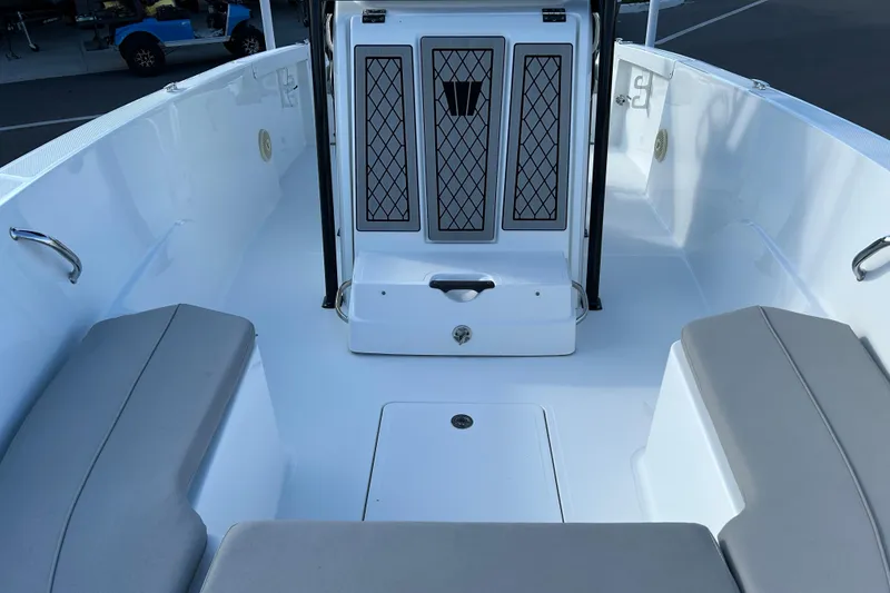 Slide: The Image of 2022 Wellcraft 202 Fisherman boat interior with seating and storage compartments. - 9