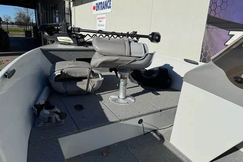 Slide: The Image of 2010 Alumacraft Fisherman 145 CS boat interior with seating and equipment. - 11