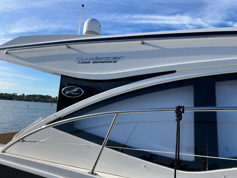 Slide: The Image of 2017 Sea Ray Sundancer 400 yacht by the water. - 1
