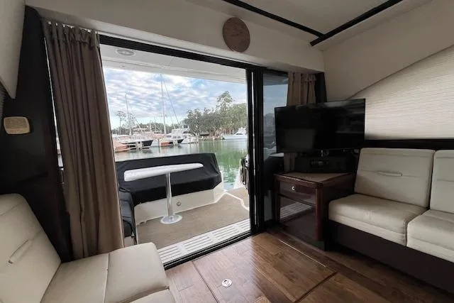 Slide: The Image of Interior view of 2017 Sea Ray Sundancer 400 yacht with modern seating and waterfront view. - 15