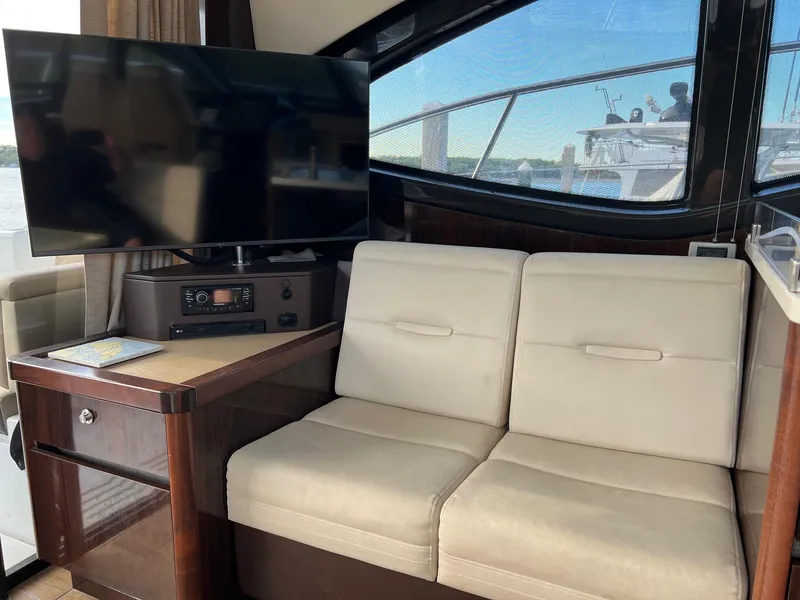 Slide: The Image of Interior of 2017 Sea Ray Sundancer 400 yacht with kitchenette and seating area. - 17