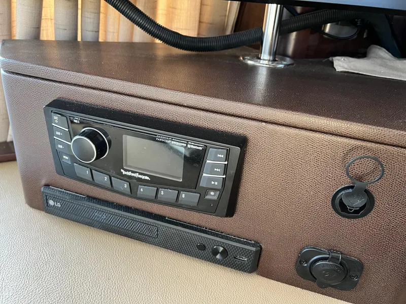 Slide: The Image of Interior of 2017 Sea Ray Sundancer 400 yacht with sofa and TV. - 18