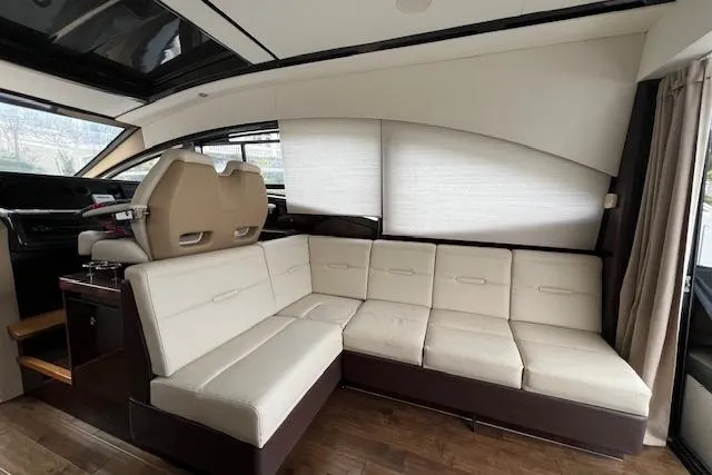 Slide: The Image of Luxurious interior of 2017 Sea Ray Sundancer 400 yacht with modern seating and kitchenette. - 19