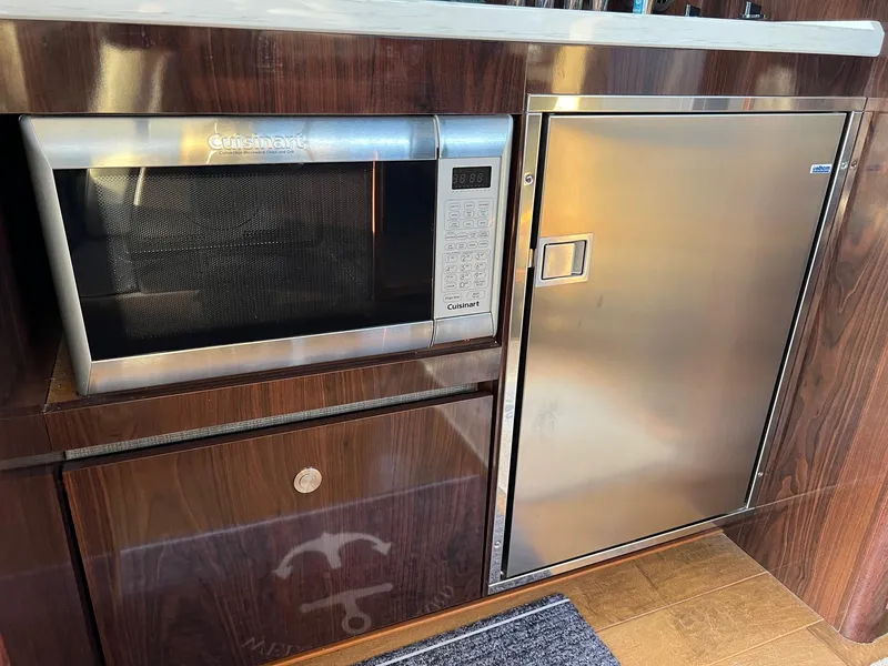 Slide: The Image of Interior of 2017 Sea Ray Sundancer 400 yacht with modern kitchen. - 25