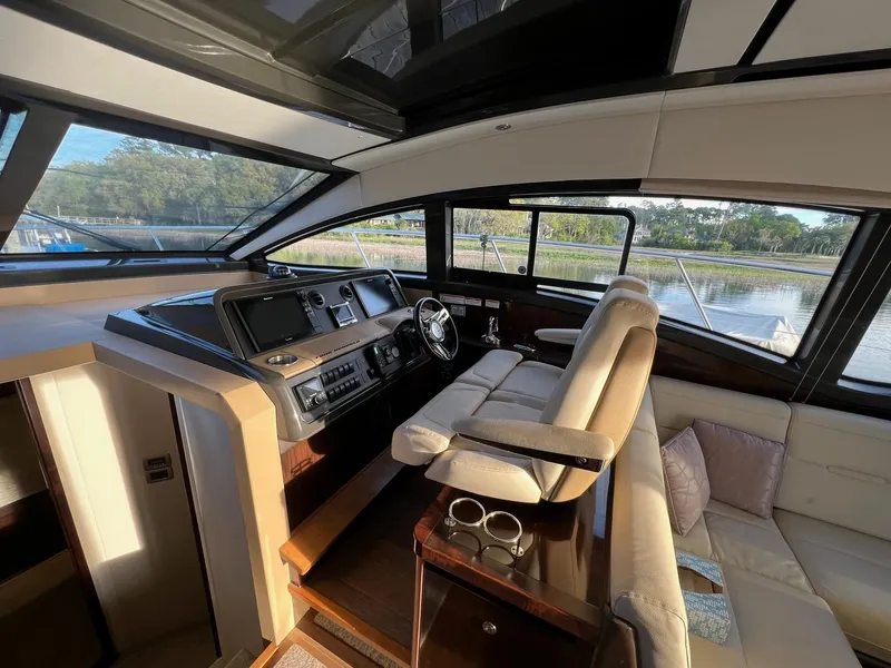 Slide: The Image of 2017 Sea Ray Sundancer 400 interior with polished wooden flooring and storage hatch. - 29