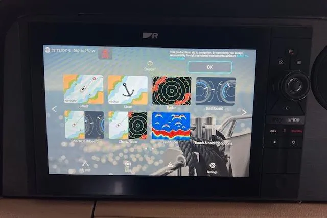 Slide: The Image of Touchscreen navigation display on 2017 Sea Ray Sundancer 400 boat, showing charts and radar options. - 37