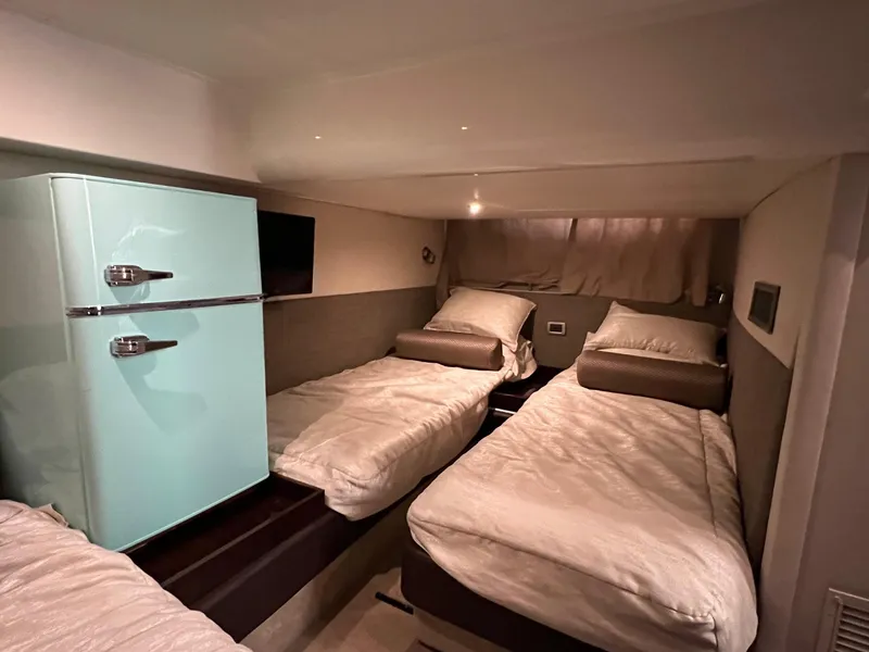 Slide: The Image of Luxurious 2017 Sea Ray Sundancer 400 cabin with twin beds and modern decor. - 40