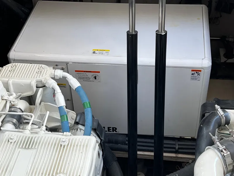 Slide: The Image of Propeller of 2017 Sea Ray Sundancer 400 on wooden blocks during maintenance. - 65