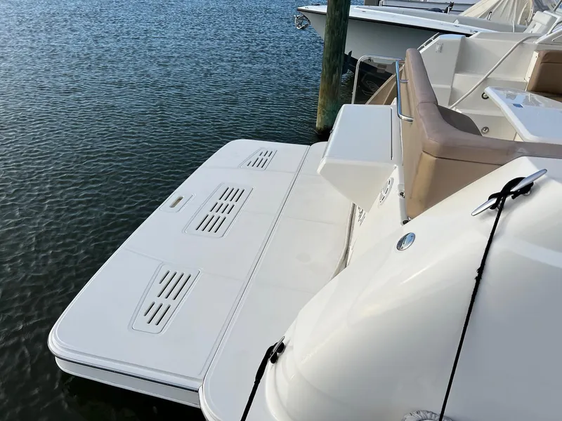 Slide: The Image of 2017 Sea Ray Sundancer 400 yacht with elegant outdoor seating area. - 7