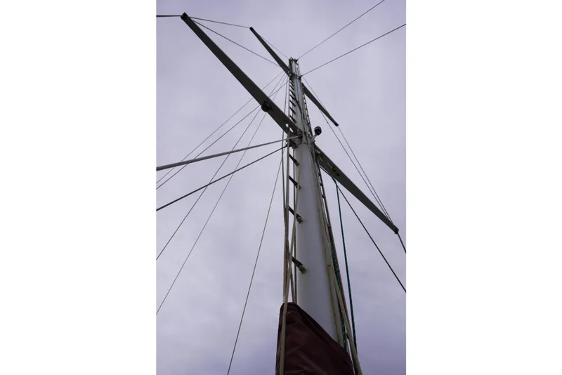 Slide: The Image of Mast of 1976 Manila Shipbuilders sailboat against cloudy sky. - 13