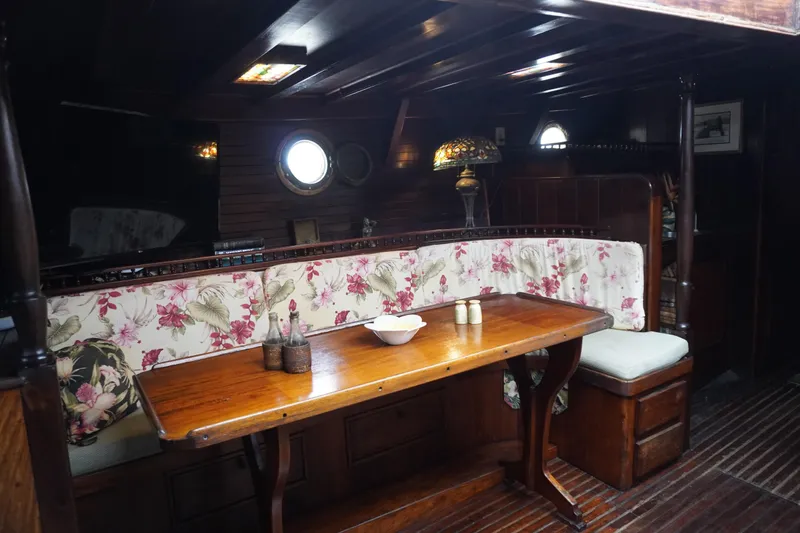 Slide: The Image of Vintage 1976 Manila Shipbuilders sailboat interior with floral upholstery and wooden dining area. - 22