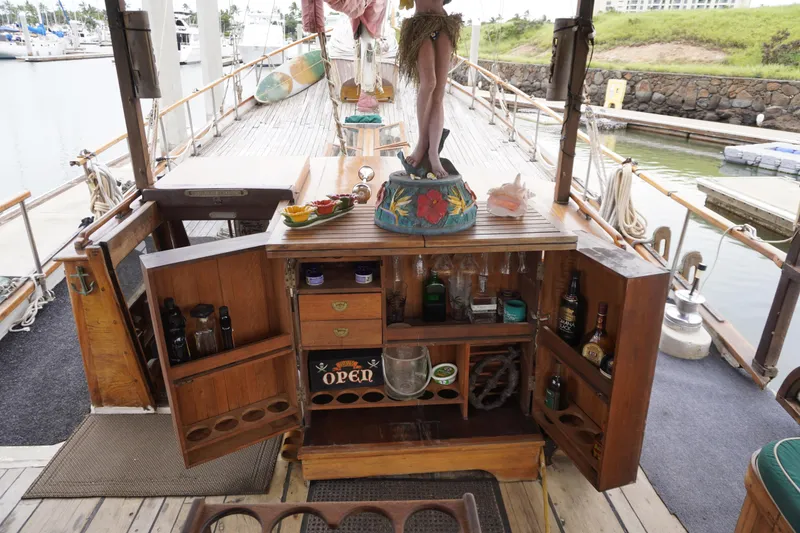 Slide: The Image of 1976 Manila Shipbuilders sailboat with open bar, docked at marina. - 33