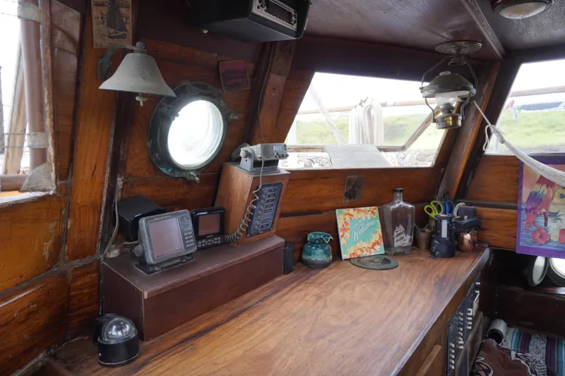 Slide: The Image of 1976 Manila Shipbuilders sailboat interior with vintage decor and navigation equipment. - 34
