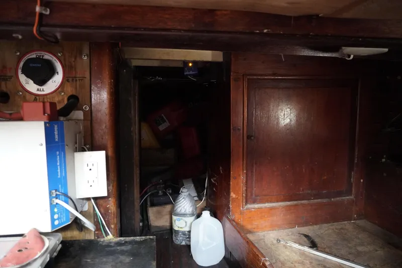 Slide: The Image of 1976 Manila Shipbuilders sailboat interior with electrical panel and wooden cabinetry. - 41