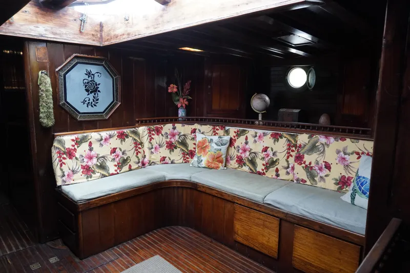 Slide: The Image of Vintage 1976 Manila Shipbuilders sailboat interior with floral upholstery and wooden accents. - 7