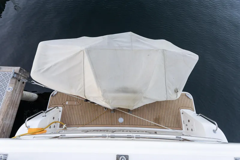 Slide: The Image of Overhead view of 2021 North Pacific 49 Pilothouse yacht docked with covered deck. - 20