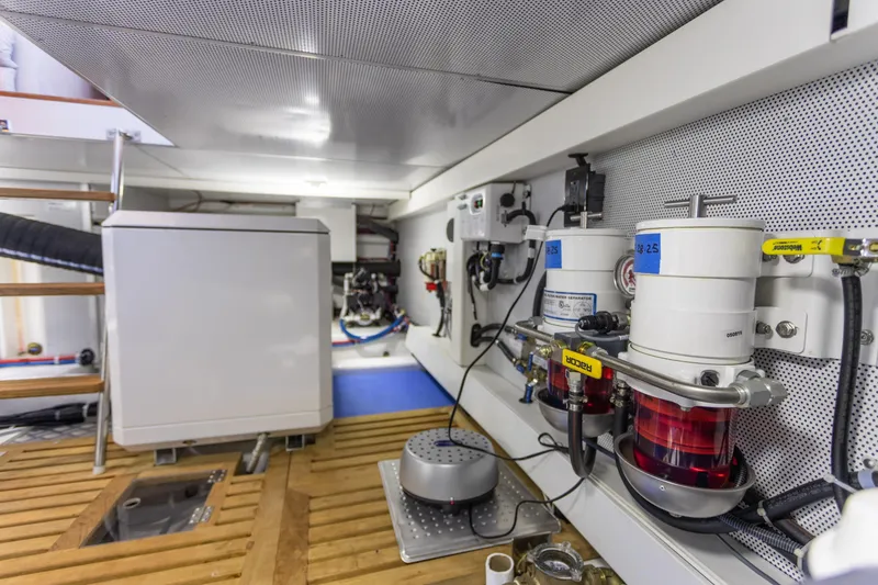Slide: The Image of Engine room of 2021 North Pacific 49 Pilothouse with fuel filters and equipment. - 31